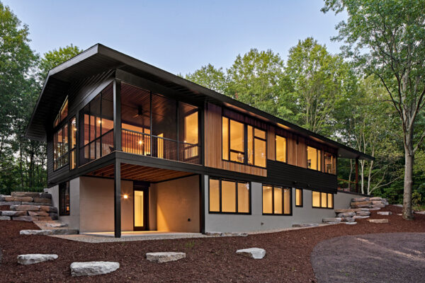 Hillside Exterior with lights on | David Bos Homes