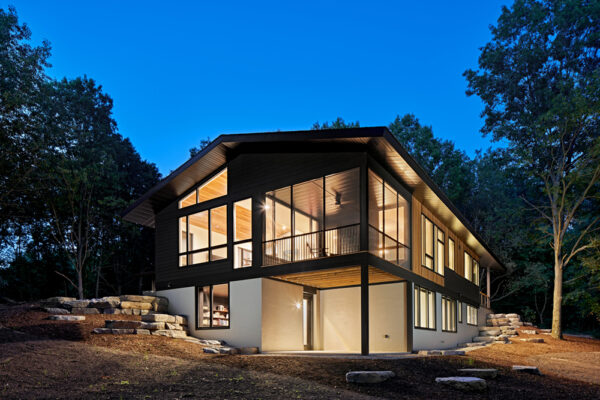 Hillside Exterior with lights on | David Bos Homes