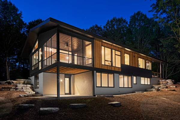 Hillside Exterior with lights on | David Bos Homes