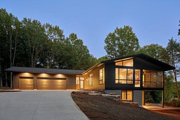 Hillside Exterior with lights on | David Bos Homes
